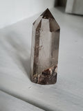 Natural polished Garden Quartz point with rutiles